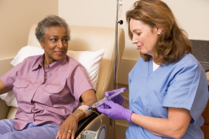 Nurse giving patient injection