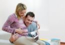 Happy pregnant young couple with baby sonogram