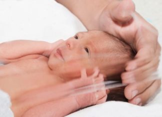 Newborn baby inside incubator