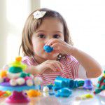 Girl playing with play dough