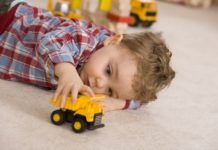 Boy playing with toy car