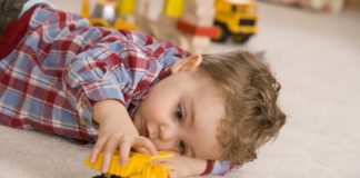 Boy playing with toy car