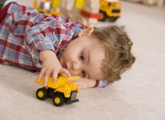 Boy playing with toy car