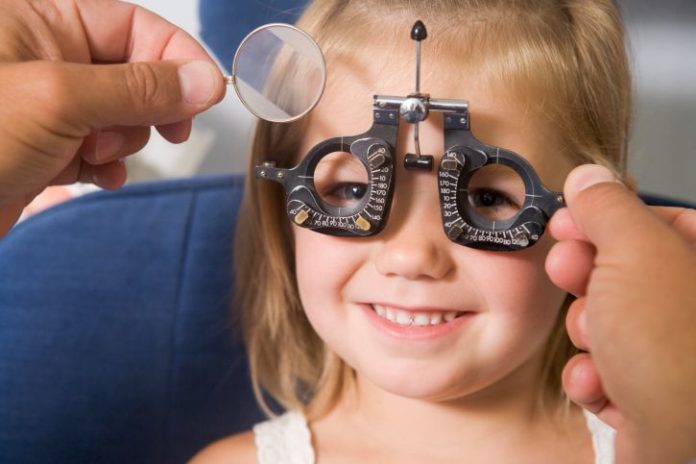 Girl getting eye exam