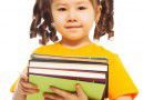 Little girl with books