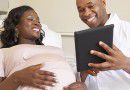 black_pregnant_woman_smiling_doctor_hospital