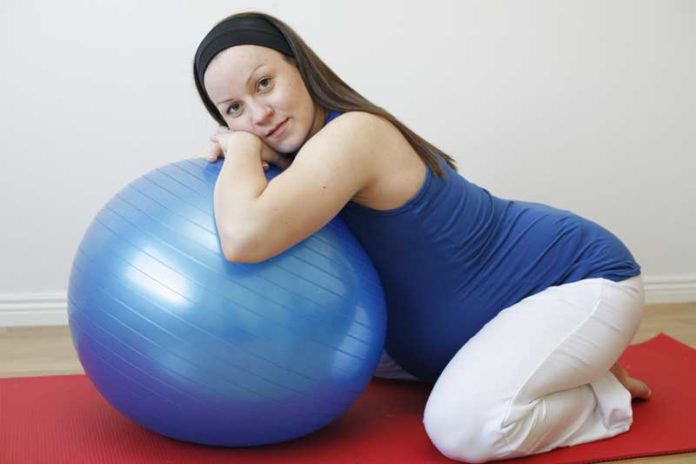 Woman and exercise ball