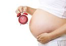 pregnant_woman_belly_red_clock_birth_time