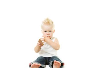 A small boy eating chocolate