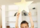 Boy holding a gold star